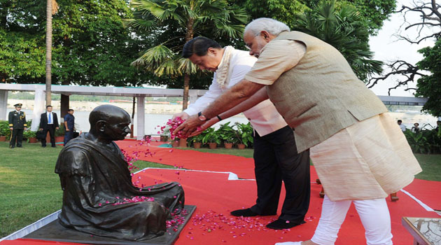 The Prime Minister, Shri Narendra Modi and the Chinese President, Mr. Xi Jinping paying floral tributes at the statue of Mahatma Gandhi, at the Sabarmati Ashram, in Ahmedabad, Gujarat on September 17, 2014.